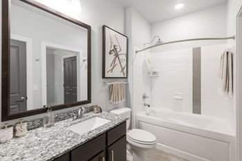 a bathroom with a bathtub and a sink